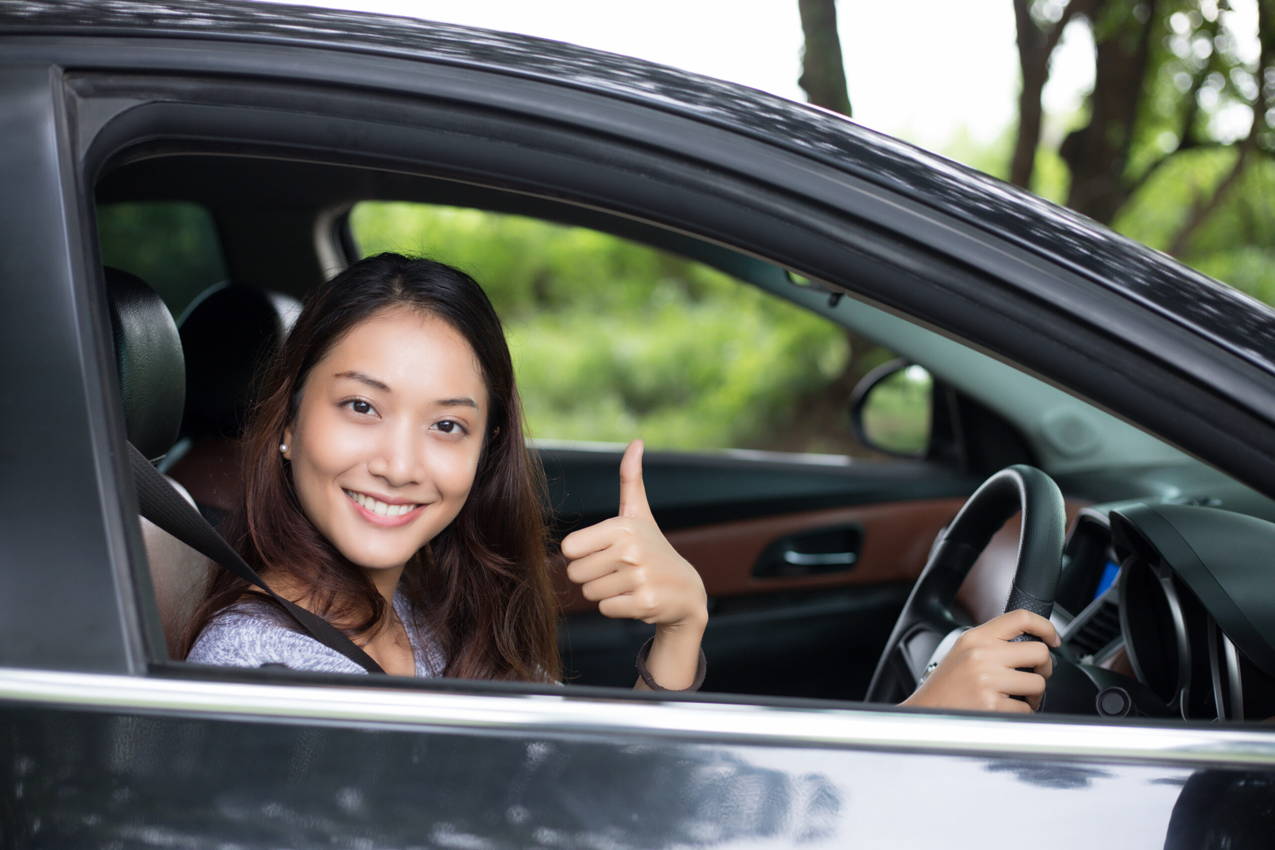 Happy student driver in Alliston giving thumbs up